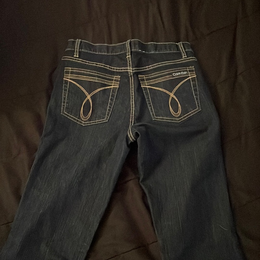 dark washed low waisted calvin klein boot cut/ flared jeans Size 6 in women